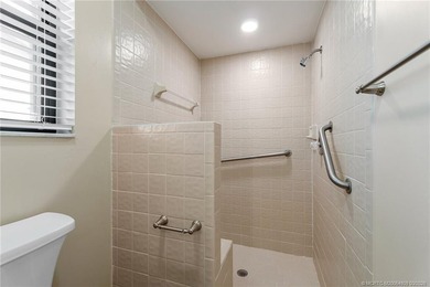 Welcome to this lovely villa set on a peaceful lake in the on Martin Downs Country Club in Florida - for sale on GolfHomes.com, golf home, golf lot