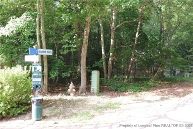 Experience the best of Carolina Trace living! This wooded corner on Carolina Trace Country Club in North Carolina - for sale on GolfHomes.com, golf home, golf lot