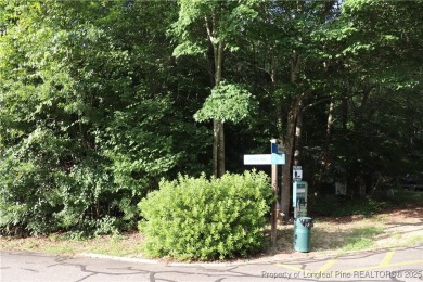 Experience the best of Carolina Trace living! This wooded corner on Carolina Trace Country Club in North Carolina - for sale on GolfHomes.com, golf home, golf lot