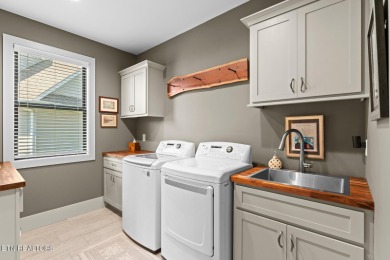 All brick custom home built in 2024 offers easy living one-level on Tellico Village -The Links At Kahite Golf Course in Tennessee - for sale on GolfHomes.com, golf home, golf lot