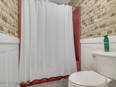 This stunning 3 bedroom 2 ful bath contemporary home W/ LOW on Pocono Farms Country Club in Pennsylvania - for sale on GolfHomes.com, golf home, golf lot