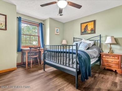 This stunning 3 bedroom 2 ful bath contemporary home W/ LOW on Pocono Farms Country Club in Pennsylvania - for sale on GolfHomes.com, golf home, golf lot