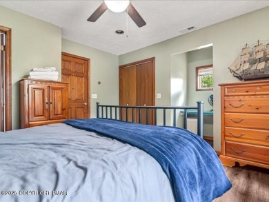 This stunning 3 bedroom 2 ful bath contemporary home W/ LOW on Pocono Farms Country Club in Pennsylvania - for sale on GolfHomes.com, golf home, golf lot