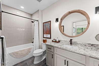 All brick custom home built in 2024 offers easy living one-level on Tellico Village -The Links At Kahite Golf Course in Tennessee - for sale on GolfHomes.com, golf home, golf lot
