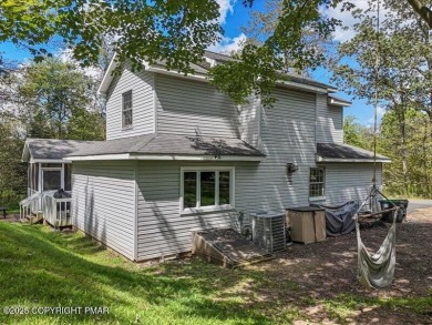 This stunning 3 bedroom 2 ful bath contemporary home W/ LOW on Pocono Farms Country Club in Pennsylvania - for sale on GolfHomes.com, golf home, golf lot