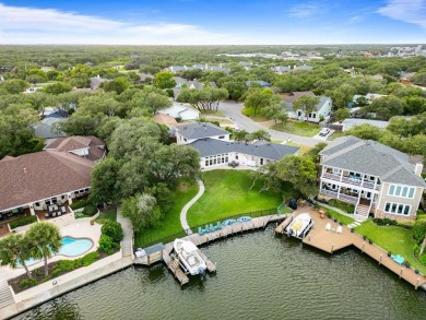 Welcome to 2110 Harbor Ct, a custom waterfront retreat located on Rockport Country Club in Texas - for sale on GolfHomes.com, golf home, golf lot