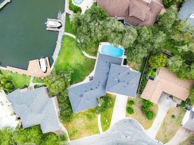 Welcome to 2110 Harbor Ct, a custom waterfront retreat located on Rockport Country Club in Texas - for sale on GolfHomes.com, golf home, golf lot