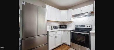 Beautifully updated 4-bedroom, 2-bath home in the highly on Twin Lakes Golf Course in North Carolina - for sale on GolfHomes.com, golf home, golf lot