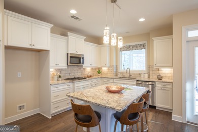 Discover relaxed, resort-style living in this charming on Lanier Island Legacy Golf Couorse in Georgia - for sale on GolfHomes.com, golf home, golf lot