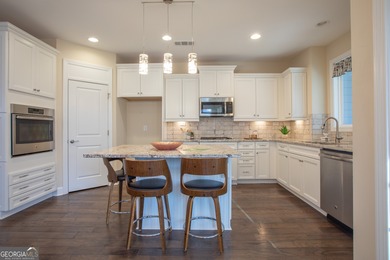 Discover relaxed, resort-style living in this charming on Lanier Island Legacy Golf Couorse in Georgia - for sale on GolfHomes.com, golf home, golf lot