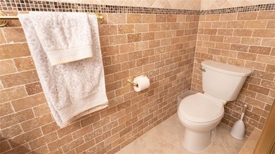 Enjoying enhanced privacy, serenity, and abundant natural light on Inverrary Country Club in Florida - for sale on GolfHomes.com, golf home, golf lot