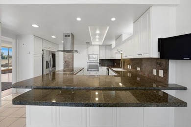 Vacation at home in this three-bedroom, three-bathroom condo in on Desert Island Golf and Country Club in California - for sale on GolfHomes.com, golf home, golf lot