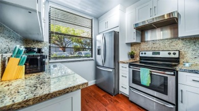 Beautifully updated 2-bed, 2-bath condo in Whitehall at Pine on Pine Island Ridge Country Club in Florida - for sale on GolfHomes.com, golf home, golf lot