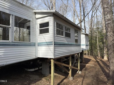 Discover the potential of this unique property located in the on River Golf and Country Club at Lake Royale in North Carolina - for sale on GolfHomes.com, golf home, golf lot