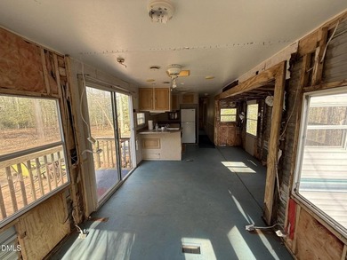 Discover the potential of this unique property located in the on River Golf and Country Club at Lake Royale in North Carolina - for sale on GolfHomes.com, golf home, golf lot