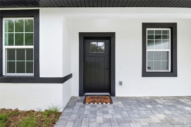 Come fall in love with this beautifully designed NEW on Citrus Springs Country Club in Florida - for sale on GolfHomes.com, golf home, golf lot