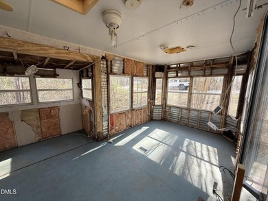 Discover the potential of this unique property located in the on River Golf and Country Club at Lake Royale in North Carolina - for sale on GolfHomes.com, golf home, golf lot