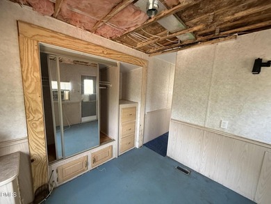 Discover the potential of this unique property located in the on River Golf and Country Club at Lake Royale in North Carolina - for sale on GolfHomes.com, golf home, golf lot