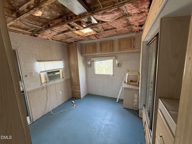 Discover the potential of this unique property located in the on River Golf and Country Club at Lake Royale in North Carolina - for sale on GolfHomes.com, golf home, golf lot