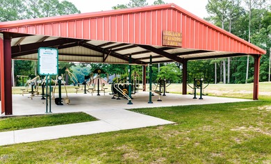 Beautiful 0.49-acre wooded lot located in the gated Lake Royale on River Golf and Country Club at Lake Royale in North Carolina - for sale on GolfHomes.com, golf home, golf lot