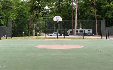 Beautiful 0.49-acre wooded lot located in the gated Lake Royale on River Golf and Country Club at Lake Royale in North Carolina - for sale on GolfHomes.com, golf home, golf lot