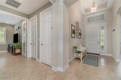 Stunning Golf & Lake Views | Oversized Saltwater Pool | on Herons Glen Golf and Country Club in Florida - for sale on GolfHomes.com, golf home, golf lot