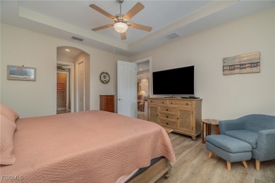 Stunning Golf & Lake Views | Oversized Saltwater Pool | on Herons Glen Golf and Country Club in Florida - for sale on GolfHomes.com, golf home, golf lot