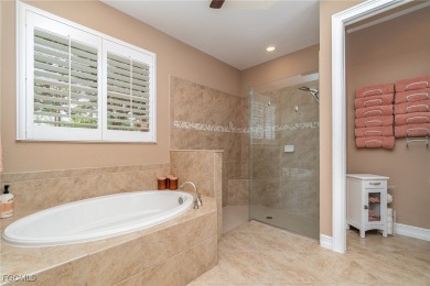 Stunning Golf & Lake Views | Oversized Saltwater Pool | on Herons Glen Golf and Country Club in Florida - for sale on GolfHomes.com, golf home, golf lot