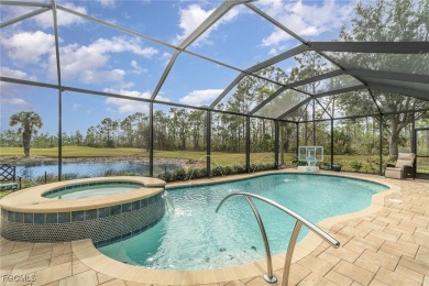 Stunning Golf & Lake Views | Oversized Saltwater Pool | on Herons Glen Golf and Country Club in Florida - for sale on GolfHomes.com, golf home, golf lot