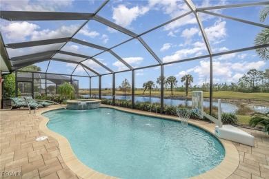 Stunning Golf & Lake Views | Oversized Saltwater Pool | on Herons Glen Golf and Country Club in Florida - for sale on GolfHomes.com, golf home, golf lot