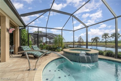 Stunning Golf & Lake Views | Oversized Saltwater Pool | on Herons Glen Golf and Country Club in Florida - for sale on GolfHomes.com, golf home, golf lot