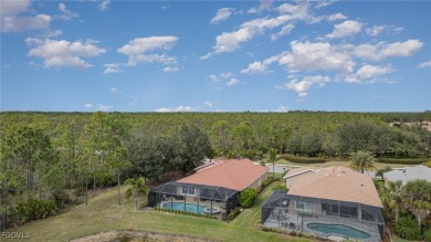 Stunning Golf & Lake Views | Oversized Saltwater Pool | on Herons Glen Golf and Country Club in Florida - for sale on GolfHomes.com, golf home, golf lot