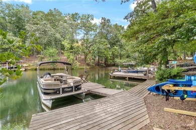 Discover your dream deep water cove home in the beautiful Lake on The Highlands Course at Lake Arrowhead in Georgia - for sale on GolfHomes.com, golf home, golf lot