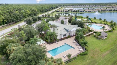 Stunning Golf & Lake Views | Oversized Saltwater Pool | on Herons Glen Golf and Country Club in Florida - for sale on GolfHomes.com, golf home, golf lot