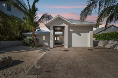 Discover your beachfront oasis directly on Tampa Bay! Step out on Key Royale Club in Florida - for sale on GolfHomes.com, golf home, golf lot