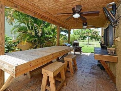 Stunning 5-Bed, 4.5-Bath courtyard pool home featuring vaulted on Jacaranda Golf Club in Florida - for sale on GolfHomes.com, golf home, golf lot