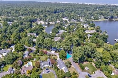 Located in the heart of Bay Colony, this four-bedroom on Cavalier Golf and Yacht Club in Virginia - for sale on GolfHomes.com, golf home, golf lot
