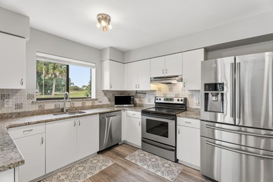 Enjoy easy living in Martin Downs Country Club, highly sought on Martin Downs Country Club in Florida - for sale on GolfHomes.com, golf home, golf lot