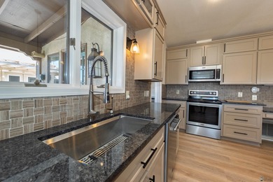 This beautiful home is ideally situated on the Mesa Del Sol Golf on Mesa Del Sol Golf Club in Arizona - for sale on GolfHomes.com, golf home, golf lot