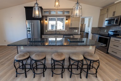 This beautiful home is ideally situated on the Mesa Del Sol Golf on Mesa Del Sol Golf Club in Arizona - for sale on GolfHomes.com, golf home, golf lot