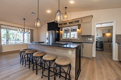 This beautiful home is ideally situated on the Mesa Del Sol Golf on Mesa Del Sol Golf Club in Arizona - for sale on GolfHomes.com, golf home, golf lot