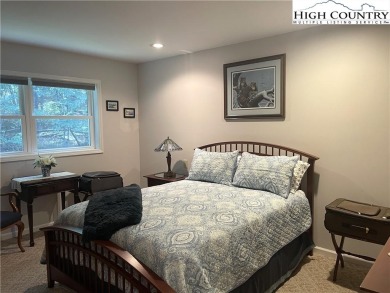 This meticulously maintained mountain home has a long-range view on Beech Mountain Club in North Carolina - for sale on GolfHomes.com, golf home, golf lot