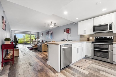 LOVE where you live in this beautifully renovated 4th Floor on Palm-Aire Country Club and Resort - Palms in Florida - for sale on GolfHomes.com, golf home, golf lot