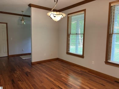 This beautiful custom built home offers 3 bedrooms/3 bathrooms on Singing Bridge Golf Course in Michigan - for sale on GolfHomes.com, golf home, golf lot