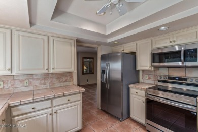Tucked in a gated 55+ community along the OMNI Tucson National on Omni Tucson National Golf Resort and Spa - Catalina in Arizona - for sale on GolfHomes.com, golf home, golf lot