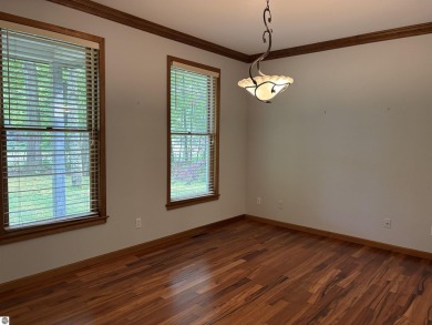 This beautiful custom built home offers 3 bedrooms/3 bathrooms on Singing Bridge Golf Course in Michigan - for sale on GolfHomes.com, golf home, golf lot