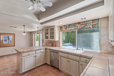 Tucked in a gated 55+ community along the OMNI Tucson National on Omni Tucson National Golf Resort and Spa - Catalina in Arizona - for sale on GolfHomes.com, golf home, golf lot