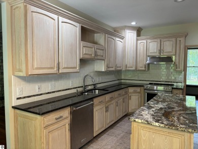 This beautiful custom built home offers 3 bedrooms/3 bathrooms on Singing Bridge Golf Course in Michigan - for sale on GolfHomes.com, golf home, golf lot