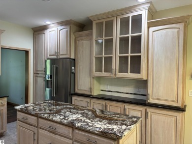 This beautiful custom built home offers 3 bedrooms/3 bathrooms on Singing Bridge Golf Course in Michigan - for sale on GolfHomes.com, golf home, golf lot