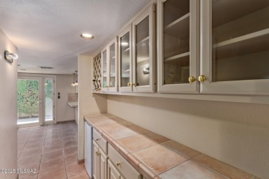 Tucked in a gated 55+ community along the OMNI Tucson National on Omni Tucson National Golf Resort and Spa - Catalina in Arizona - for sale on GolfHomes.com, golf home, golf lot